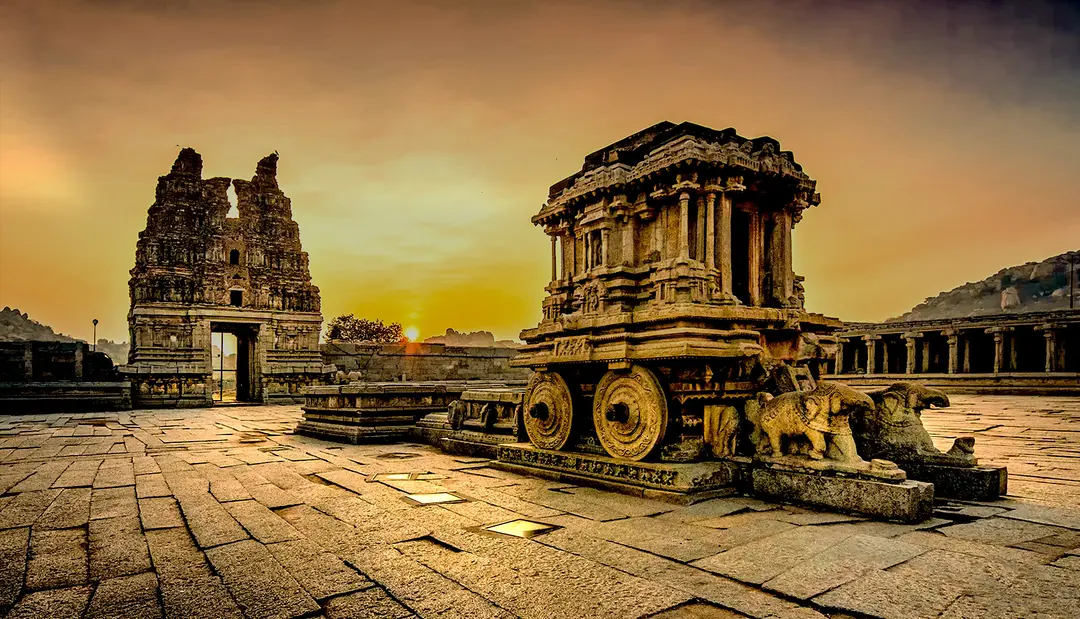 Ancient stone temple architecture in Hampi — heritage backdrop for corporate retreats and leadership offsites