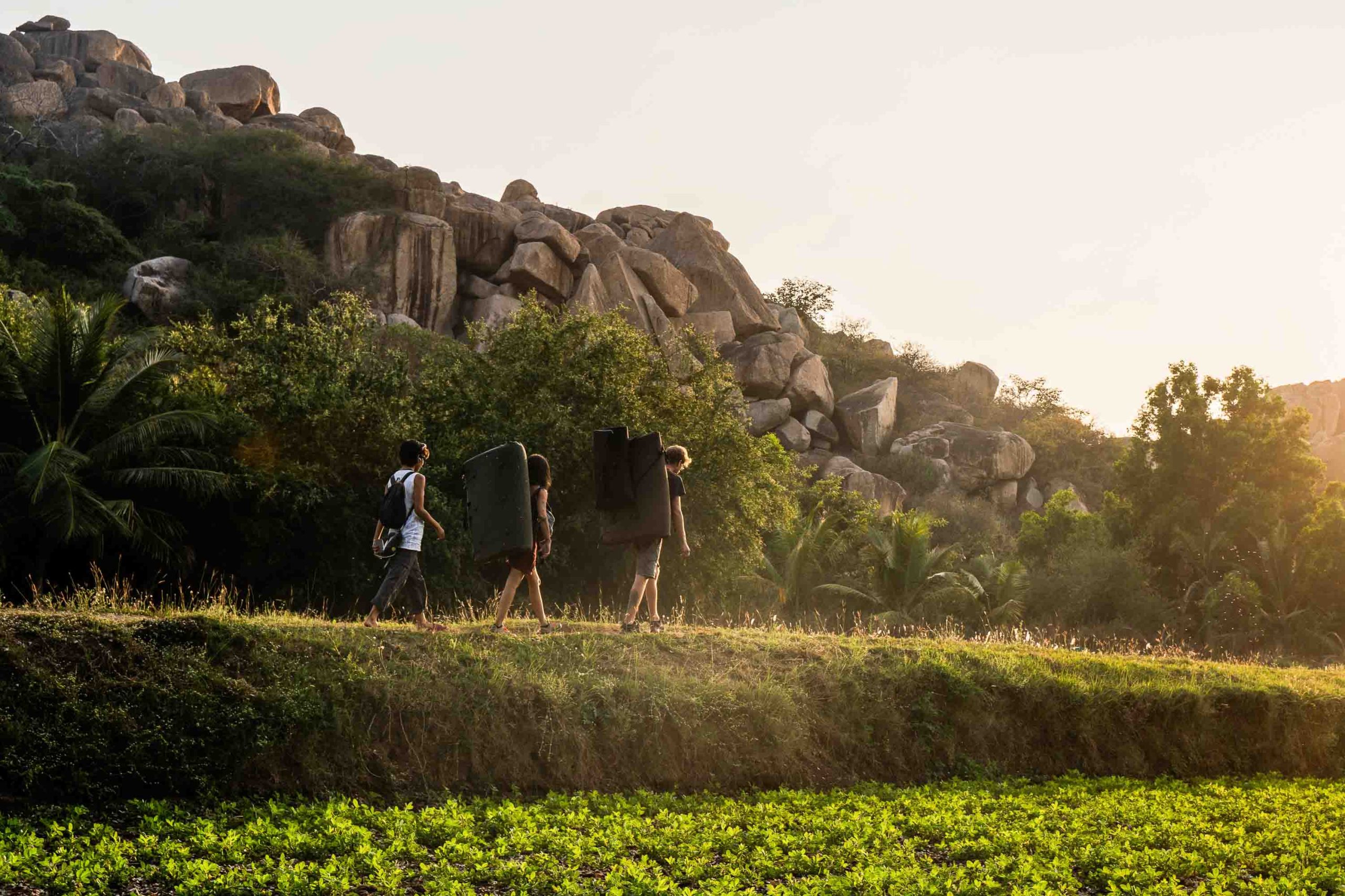Team trekking through Hampi boulder country for outdoor reflection and strategy offsites