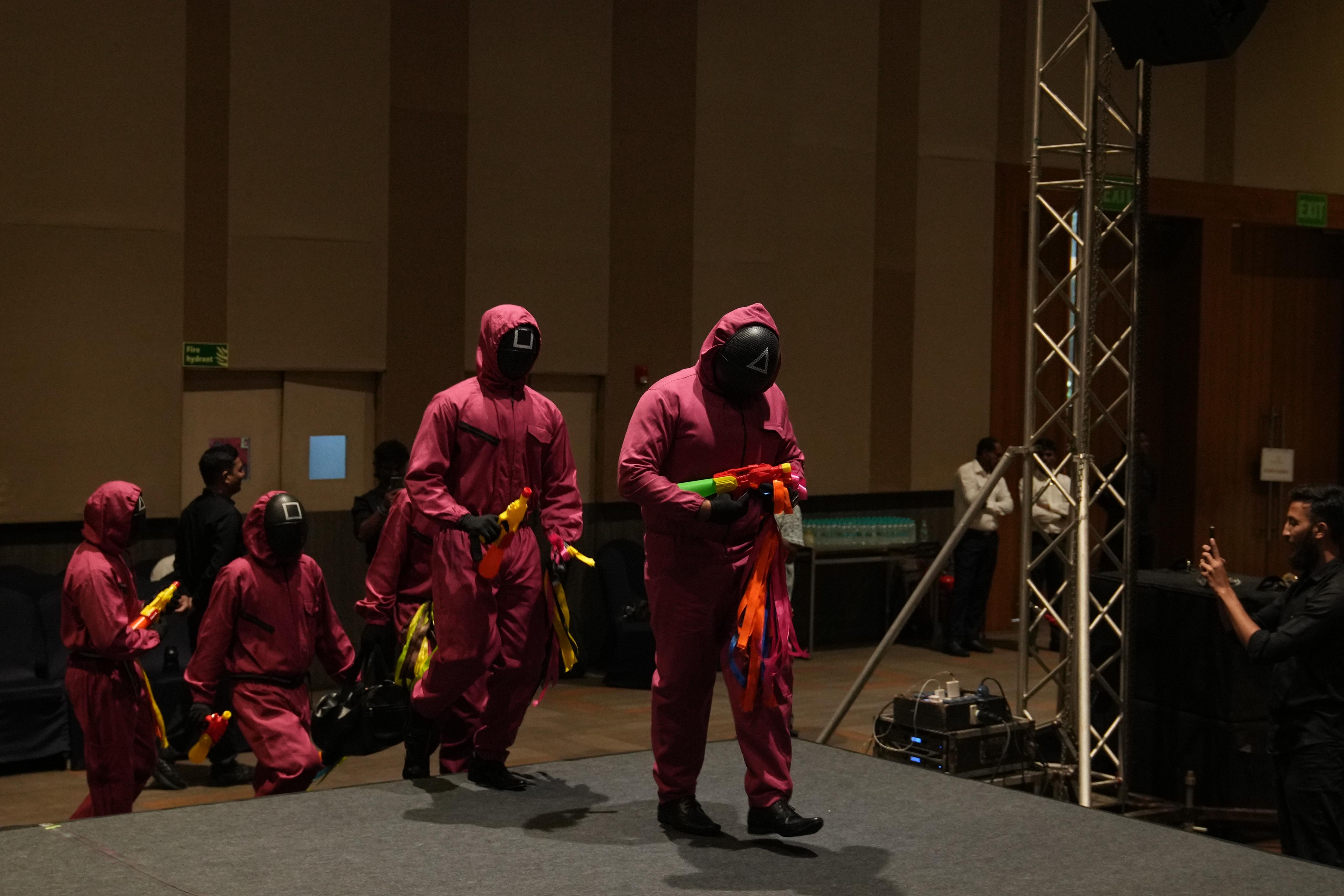 Themed performers making a dramatic stage entrance