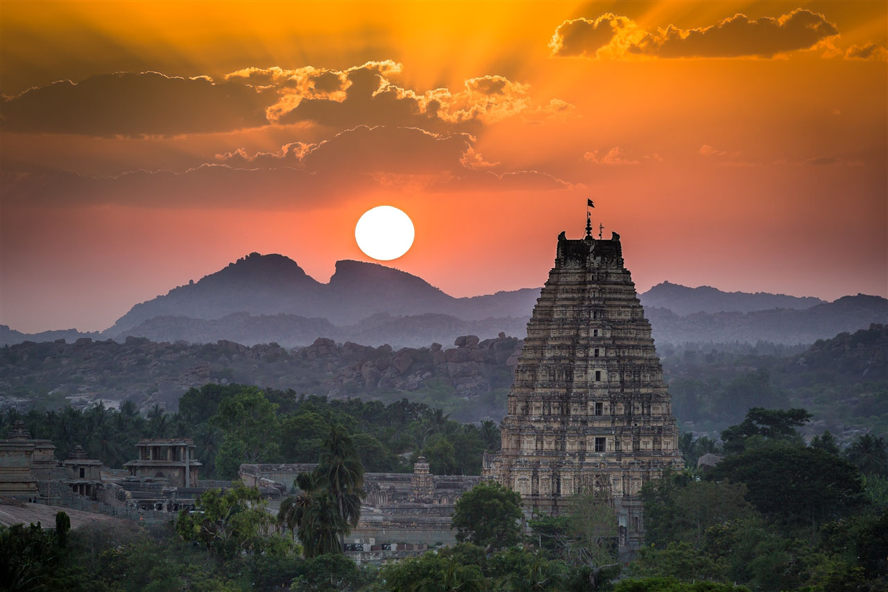 Sunrise over Virupaksha temple and Hampi hills — memorable moments for corporate retreat groups