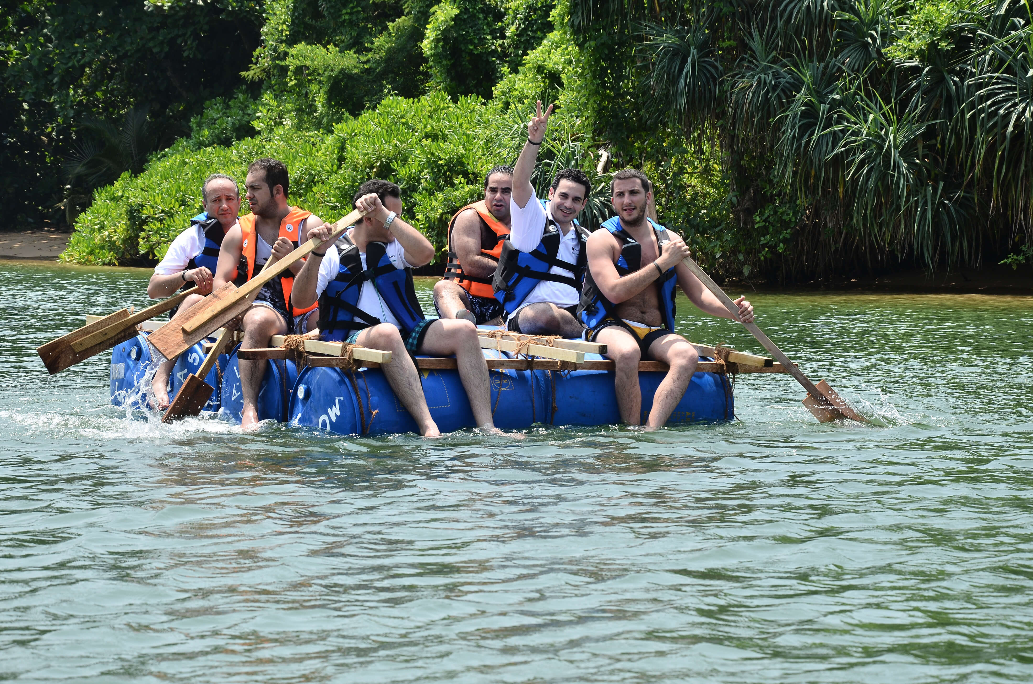 Adventure-based corporate team outing with ziplining and obstacle challenges